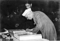 Nehru Signing on the Book of Constitution of India